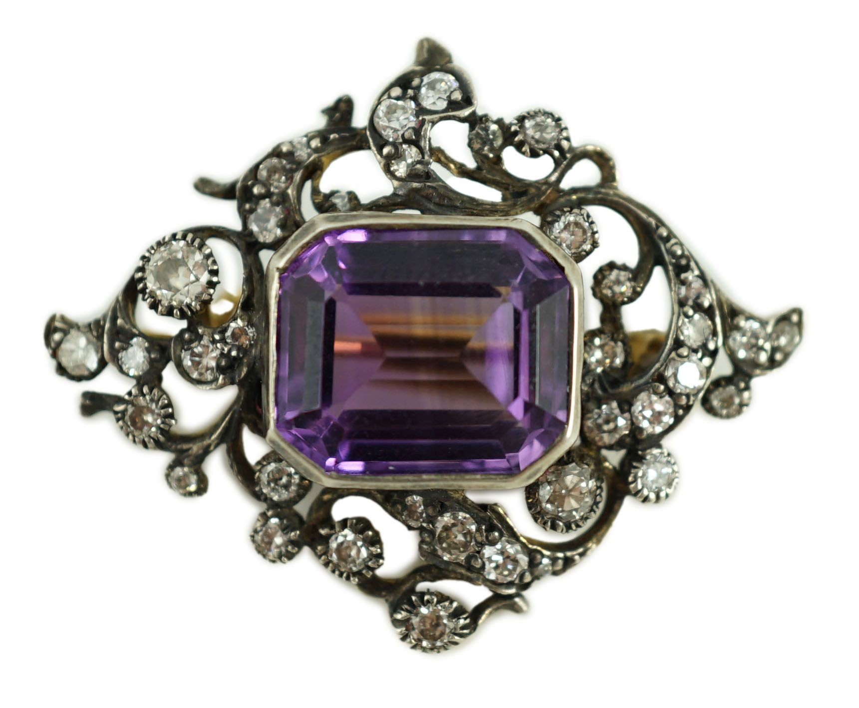 A Victorian gold and silver, emerald cut amethyst and diamond cluster set brooch